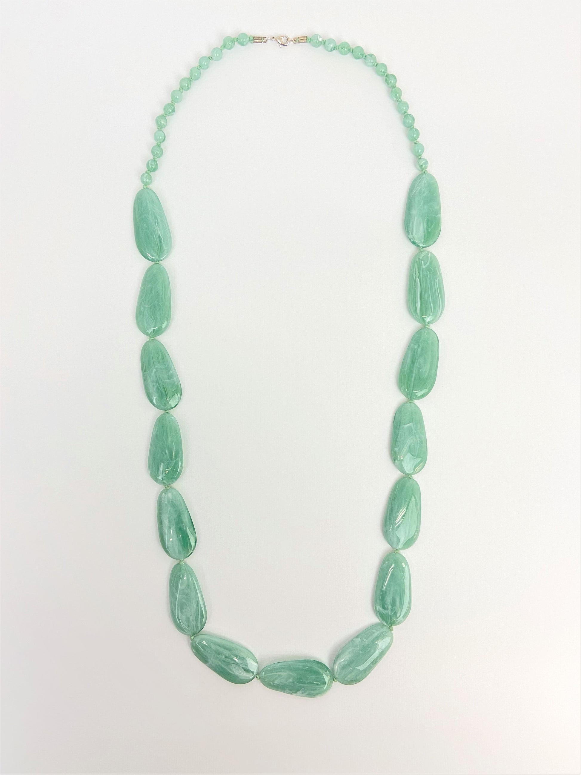 Riverside Pebble Necklace by Stage Jewellery with green tones
