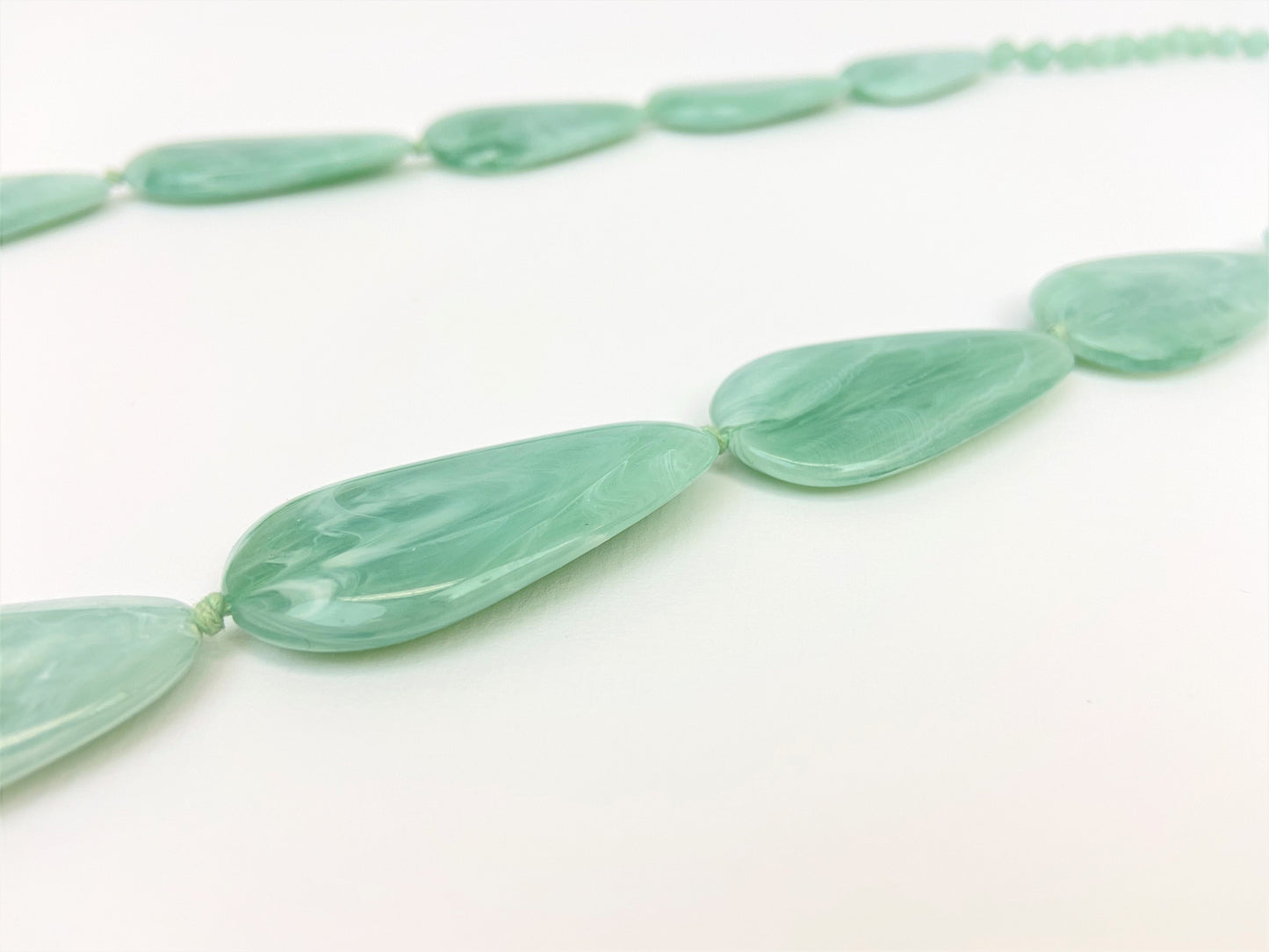 Riverside Pebble Necklace by Stage Jewellery with green tones
