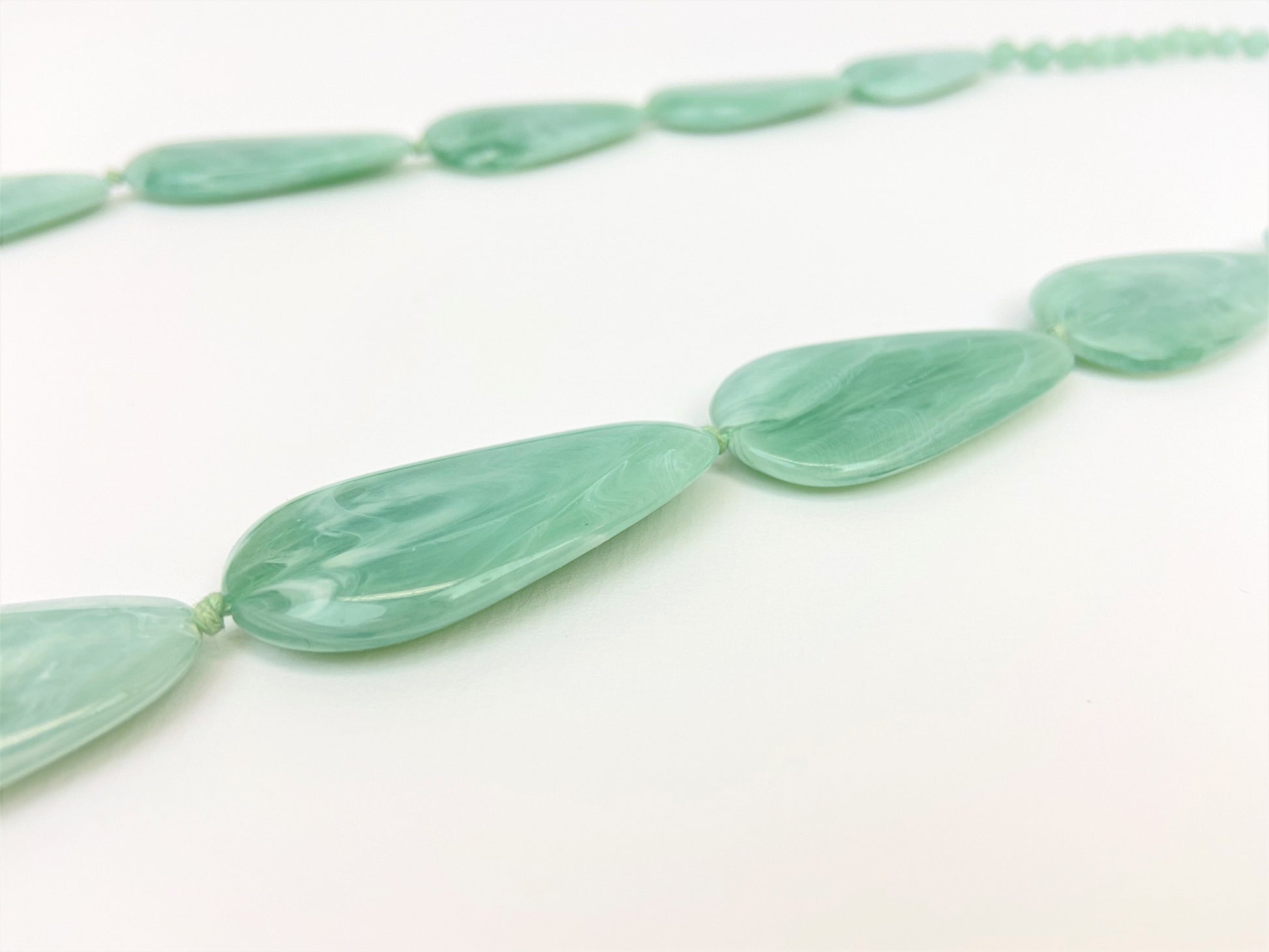 Riverside Pebble Necklace by Stage Jewellery with green tones