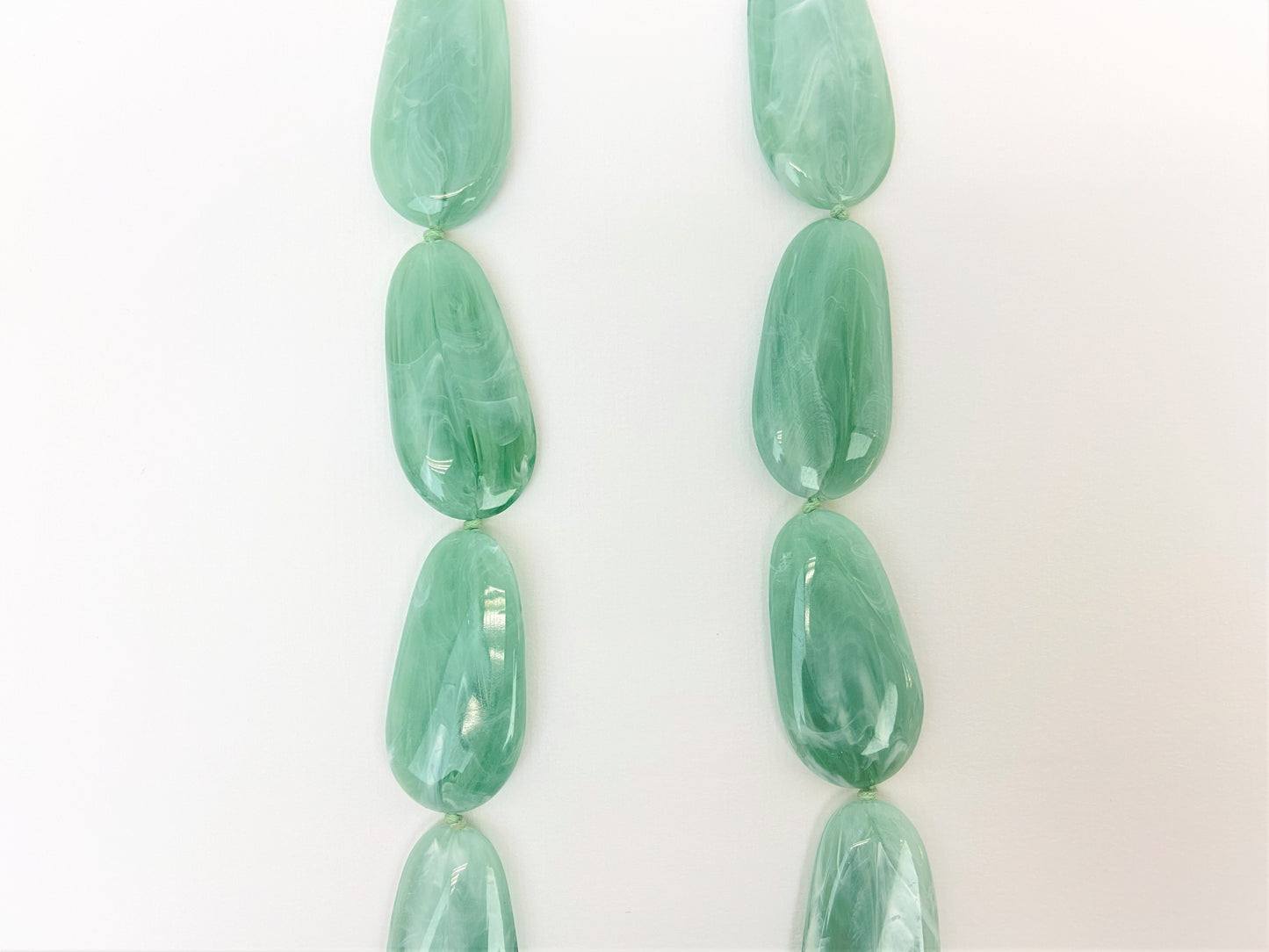 Riverside Pebble Necklace by Stage Jewellery with green tones