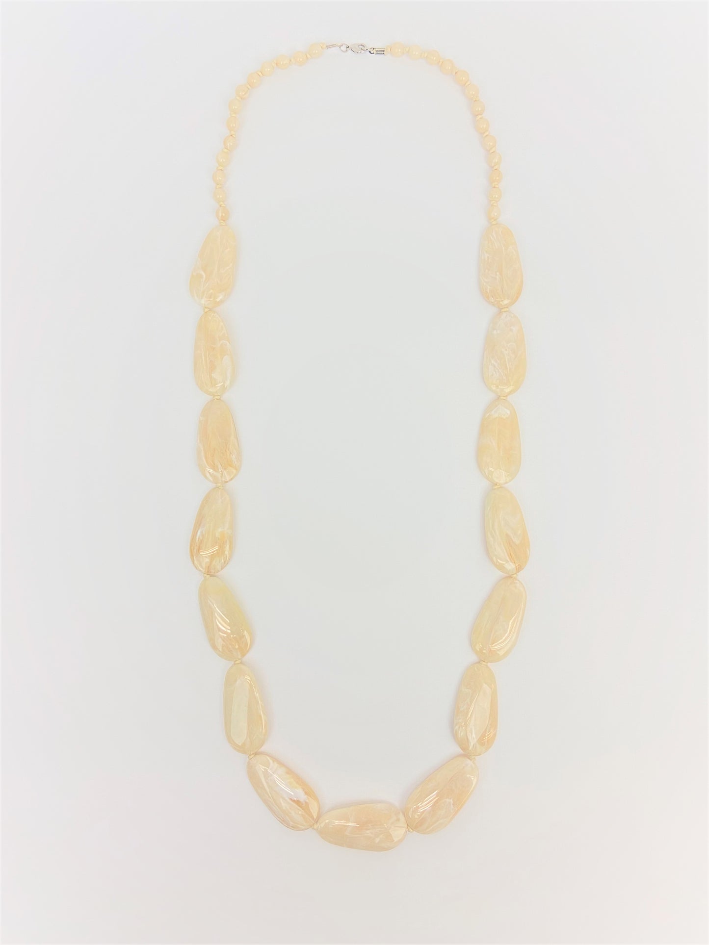 Macaroon Pebble Necklace by Stage Jewellery with neutral tones and flat beads