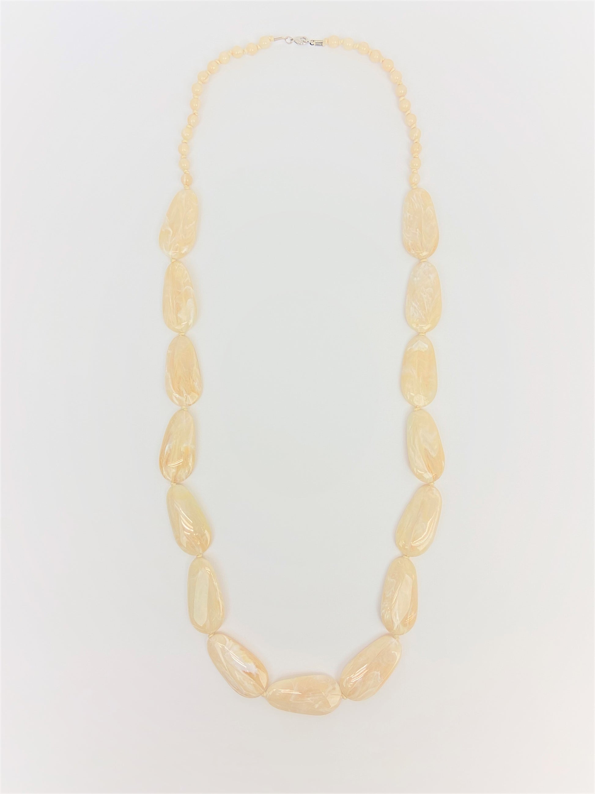 Macaroon Pebble Necklace by Stage Jewellery with neutral tones and flat beads
