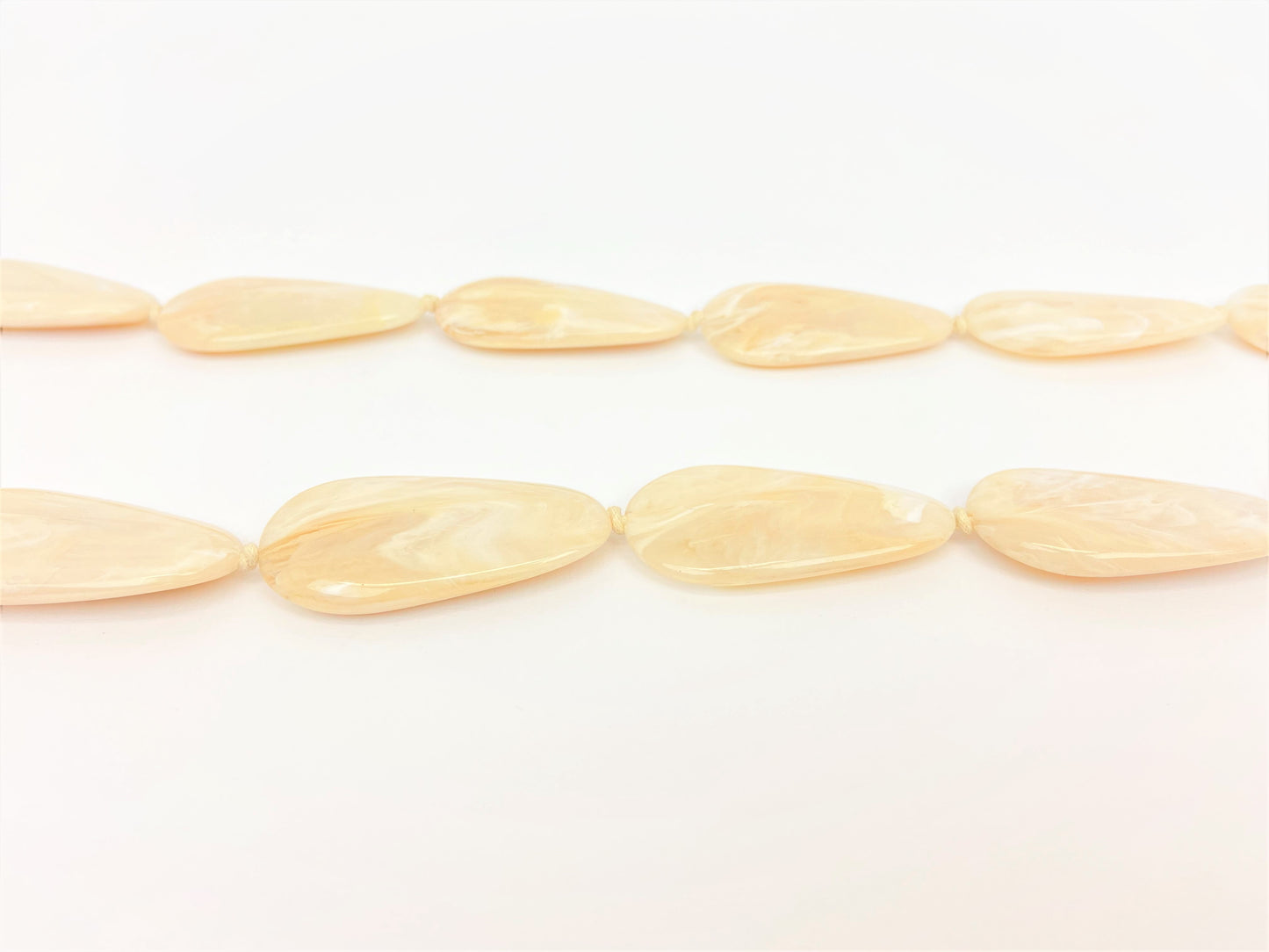 Macaroon Pebble Necklace by Stage Jewellery with neutral tones and flat beads
