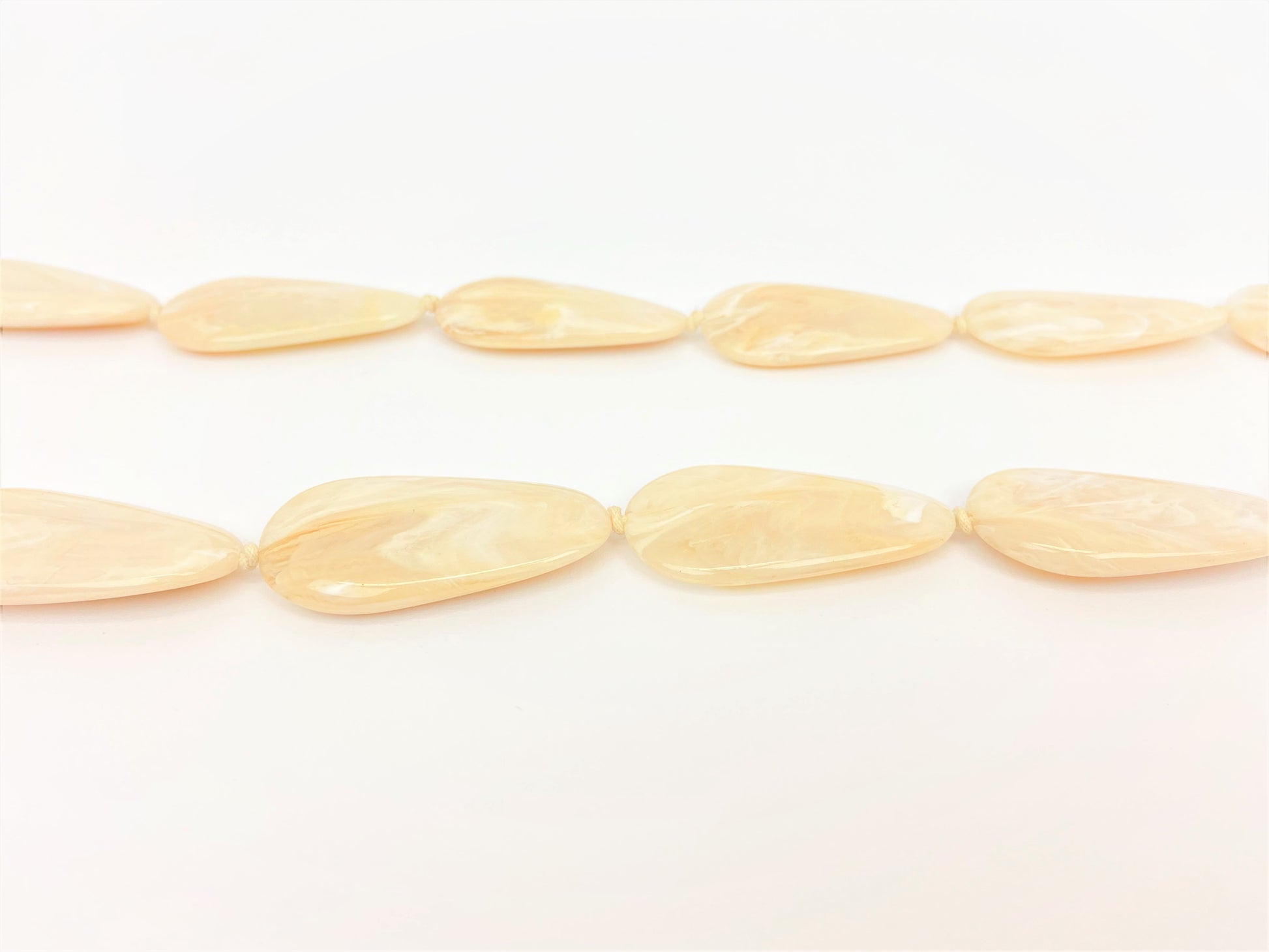 Macaroon Pebble Necklace by Stage Jewellery with neutral tones and flat beads