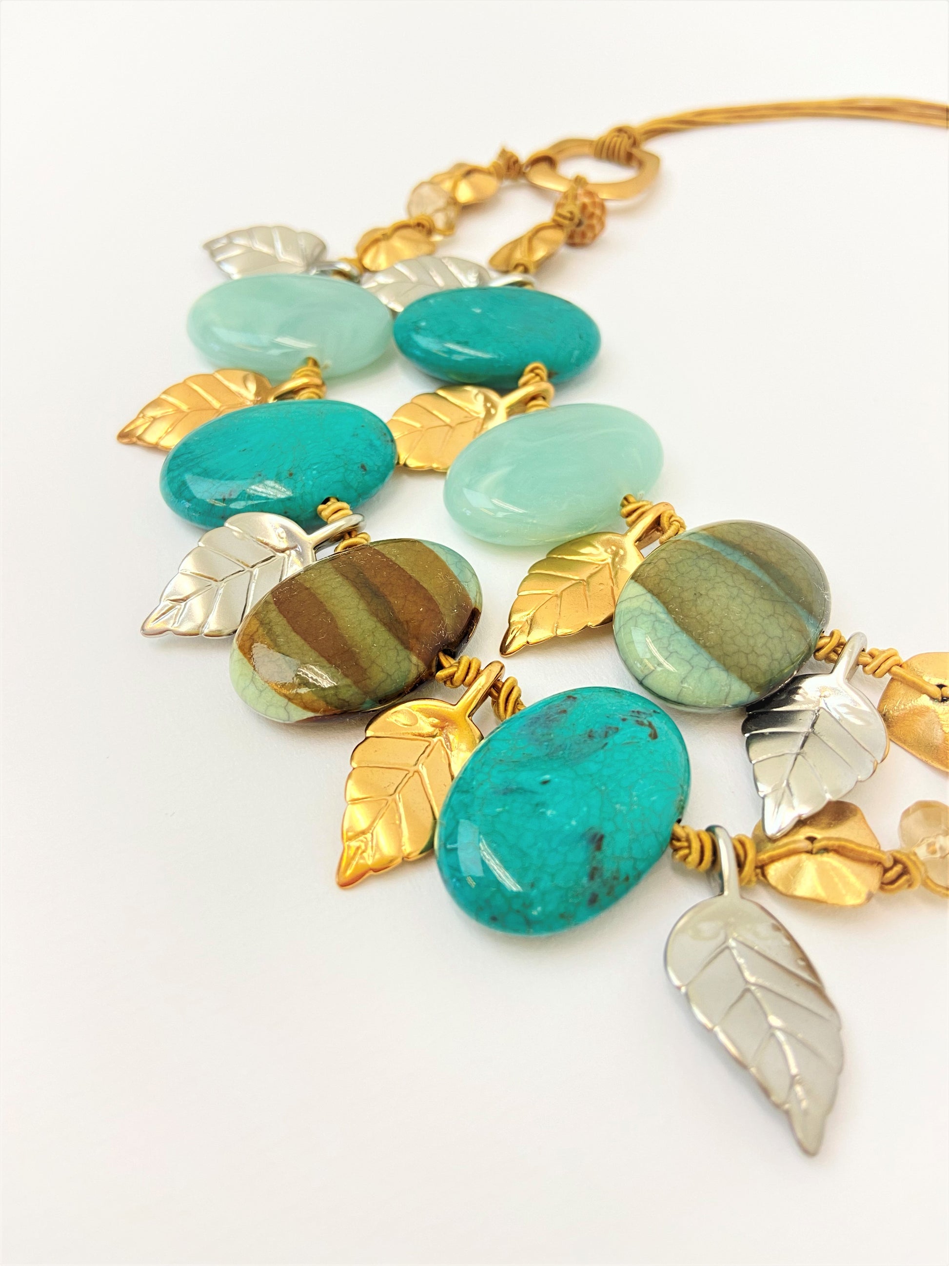 Dino Dream Mixed Bead Necklace by Stage Jewellery in cyan teal earth tones with gold and silver leaves
