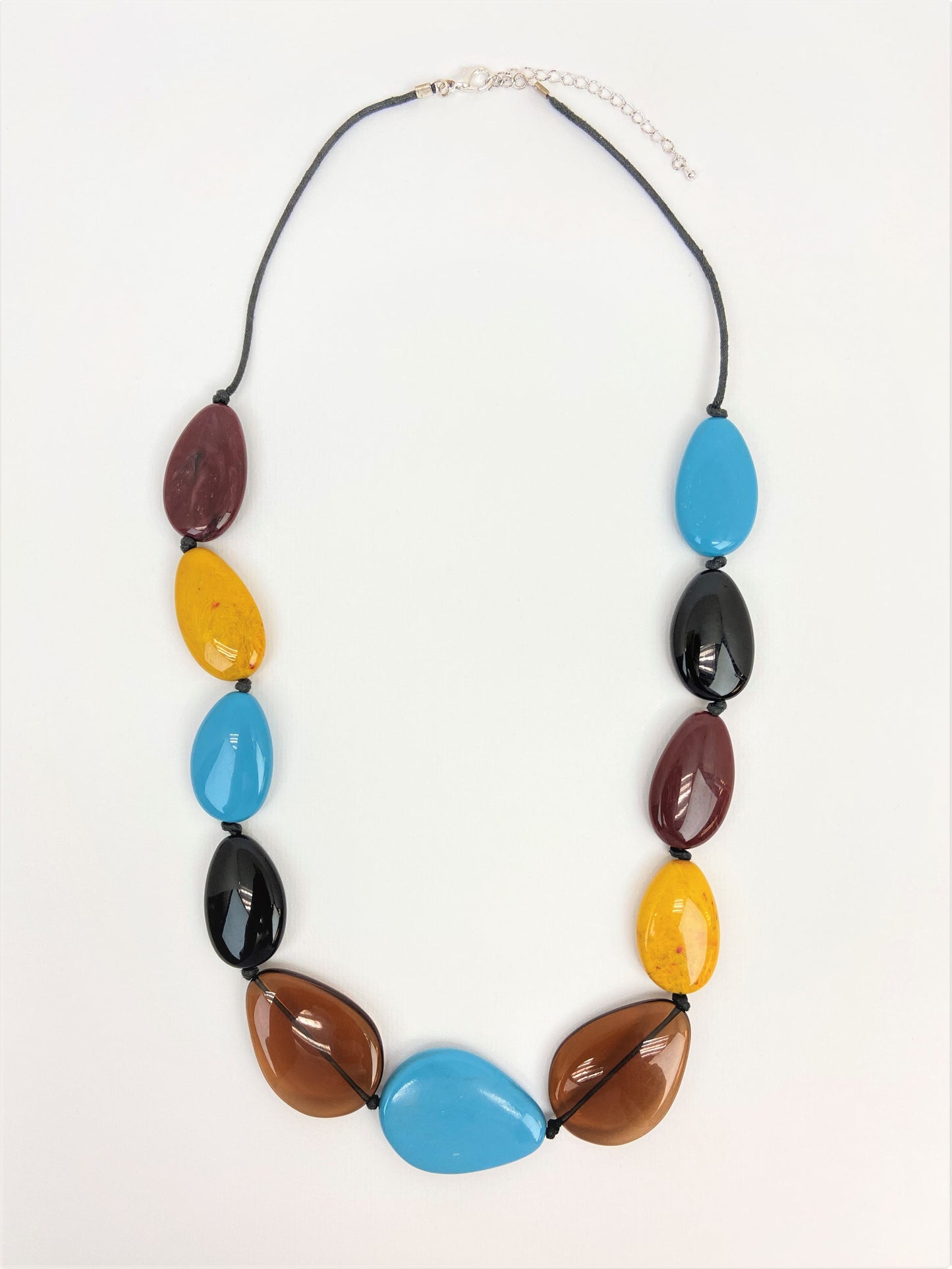 Muriel Lustre Pebble Bead Necklace by Stage Jewellery in black brown blue yellow tones