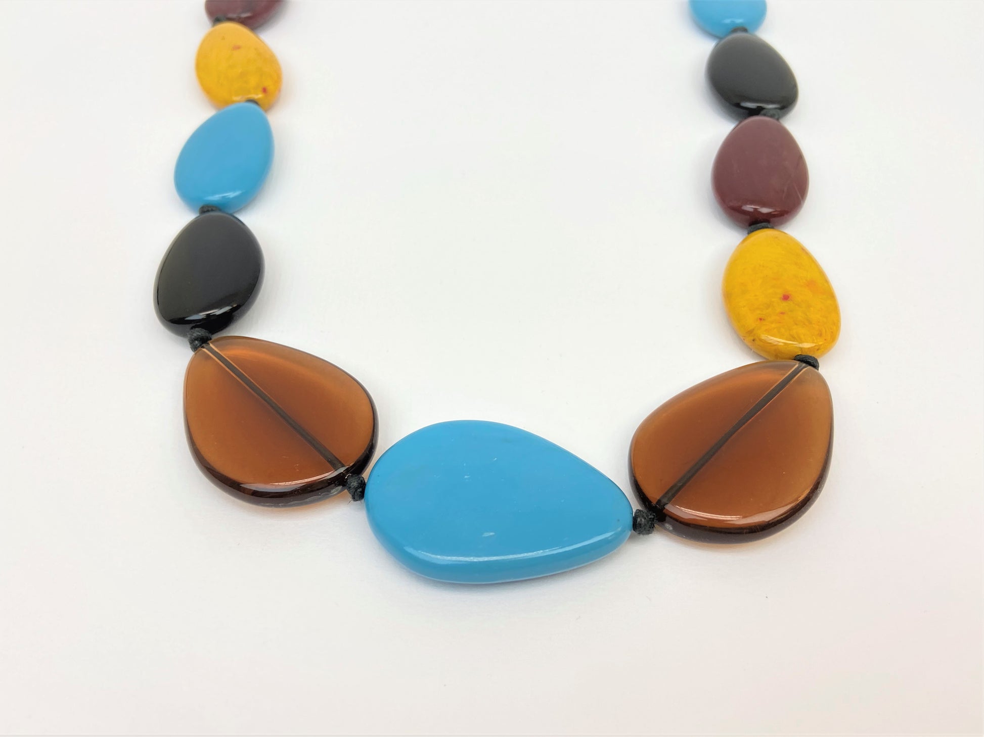 Muriel Lustre Pebble Bead Necklace by Stage Jewellery in black brown blue yellow tones