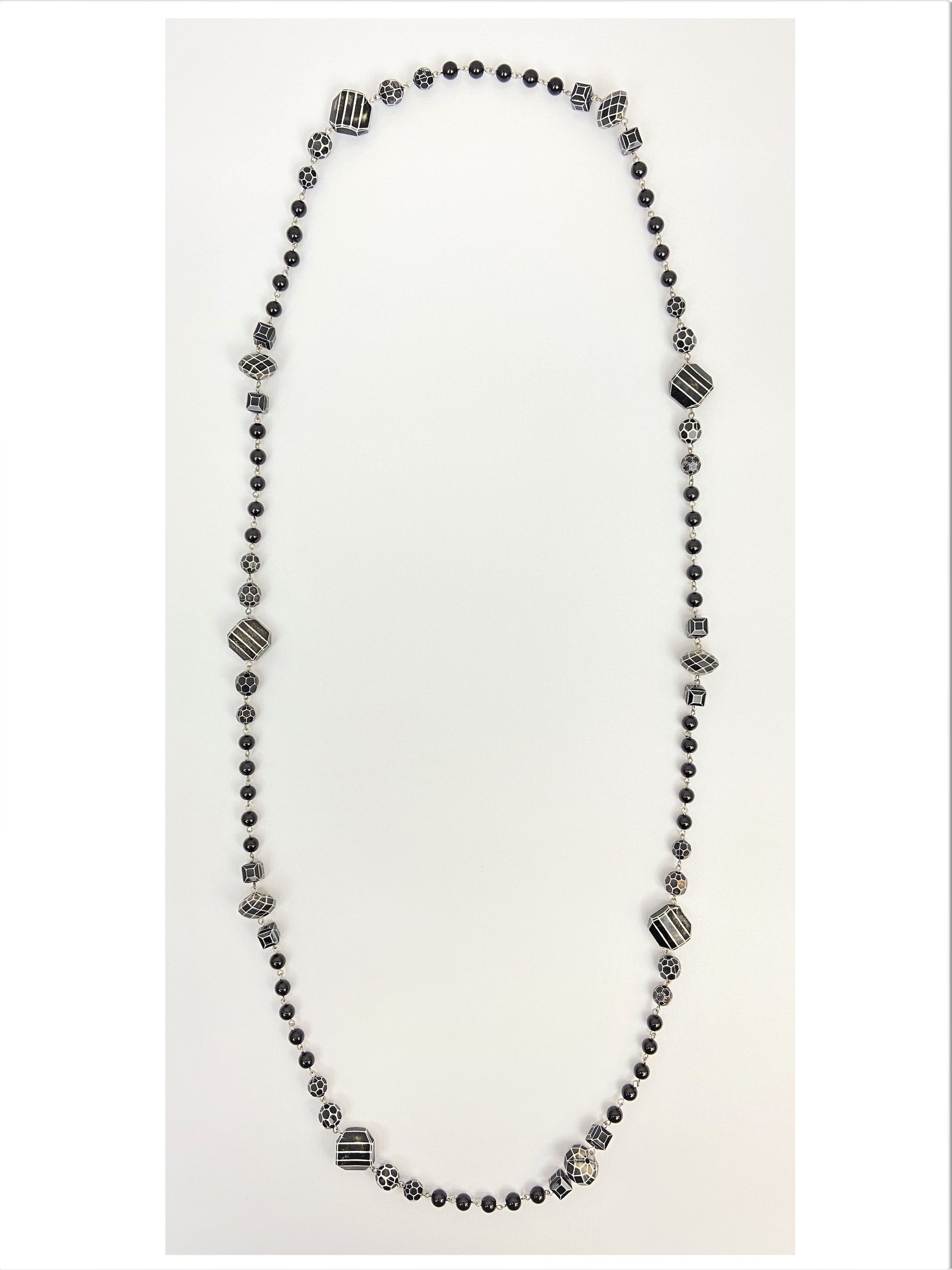 Millie Orca Mixed Bead Necklace by Stage Jewellery with black and white tones in vintage fashion style