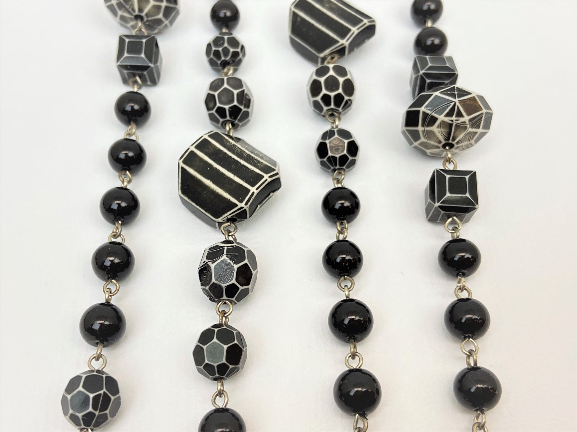 Millie Orca Mixed Bead Necklace by Stage Jewellery with black and white tones in vintage fashion style